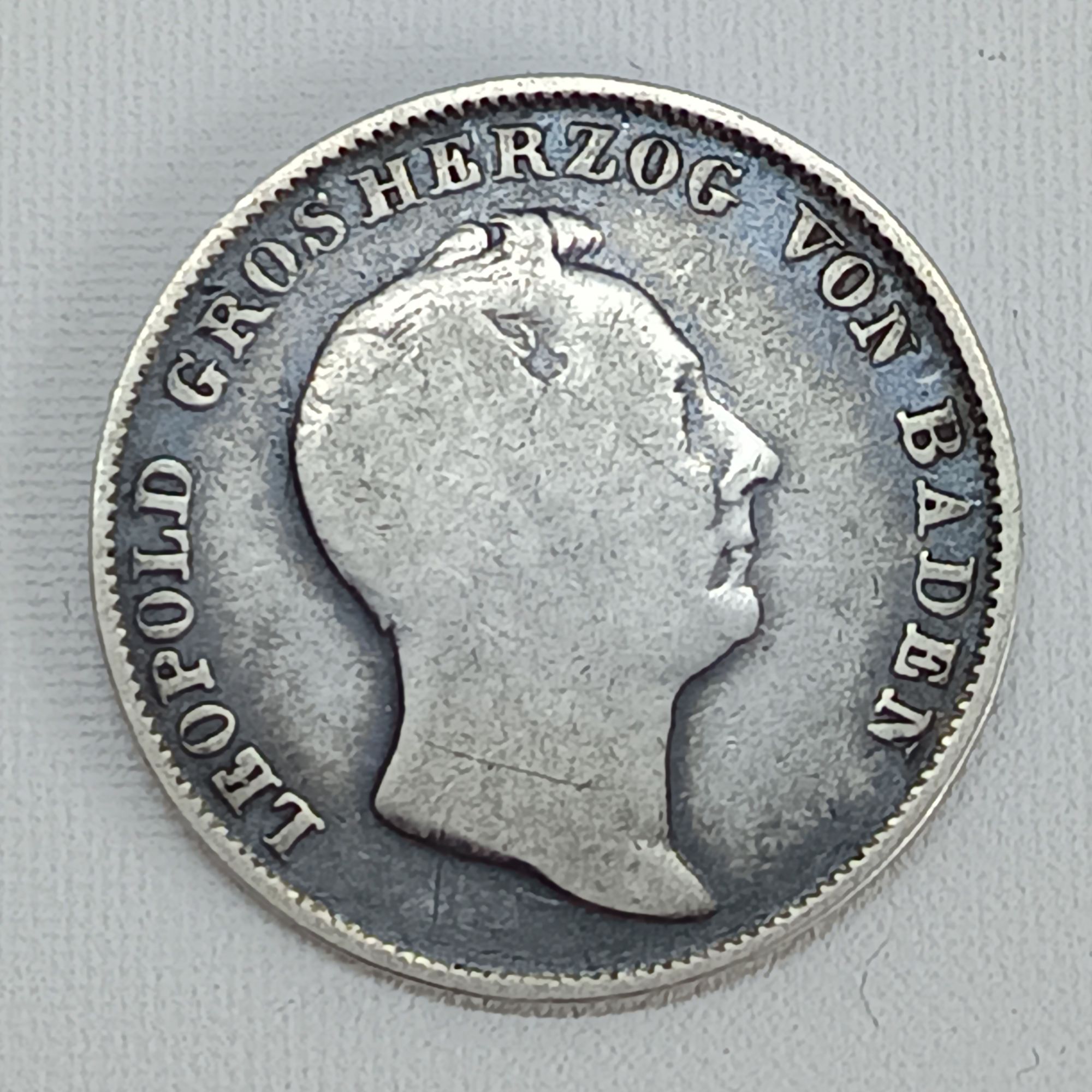 The "1/2 Gulden Léopold 1er 1838" is a silver coin from the German state of Baden, issued under the reign of Grand Duke Leopold I. Here are some key details about this coin: * Country: German States (specifically, the Grand Duchy of Baden) * Ruler: Leopold I (reigned 1830-1852) * Denomination: 1/2 Gulden * Year: 1838 * Composition: Silver (.900 fine) * Weight: 5.303 grams * Diameter: 24.2 mm * Obverse: Features the bust of Grand Duke Leopold I. * Reverse: Typically shows the denomination and date within a wreath. The value of the coin can vary significantly depending on its condition, rarity, and market demand. You can find examples of these coins for sale on numismatic websites and at auctions.