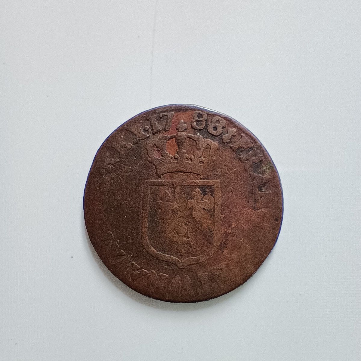 La pièce de monnaie de demi-sol Louis XVI 1788 AA dit à l'écu, Metz